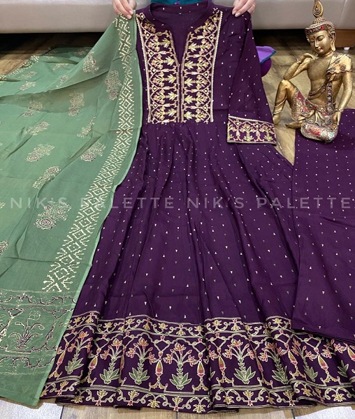 A Premium slub silk Anarkali gown with all over foil print & hea